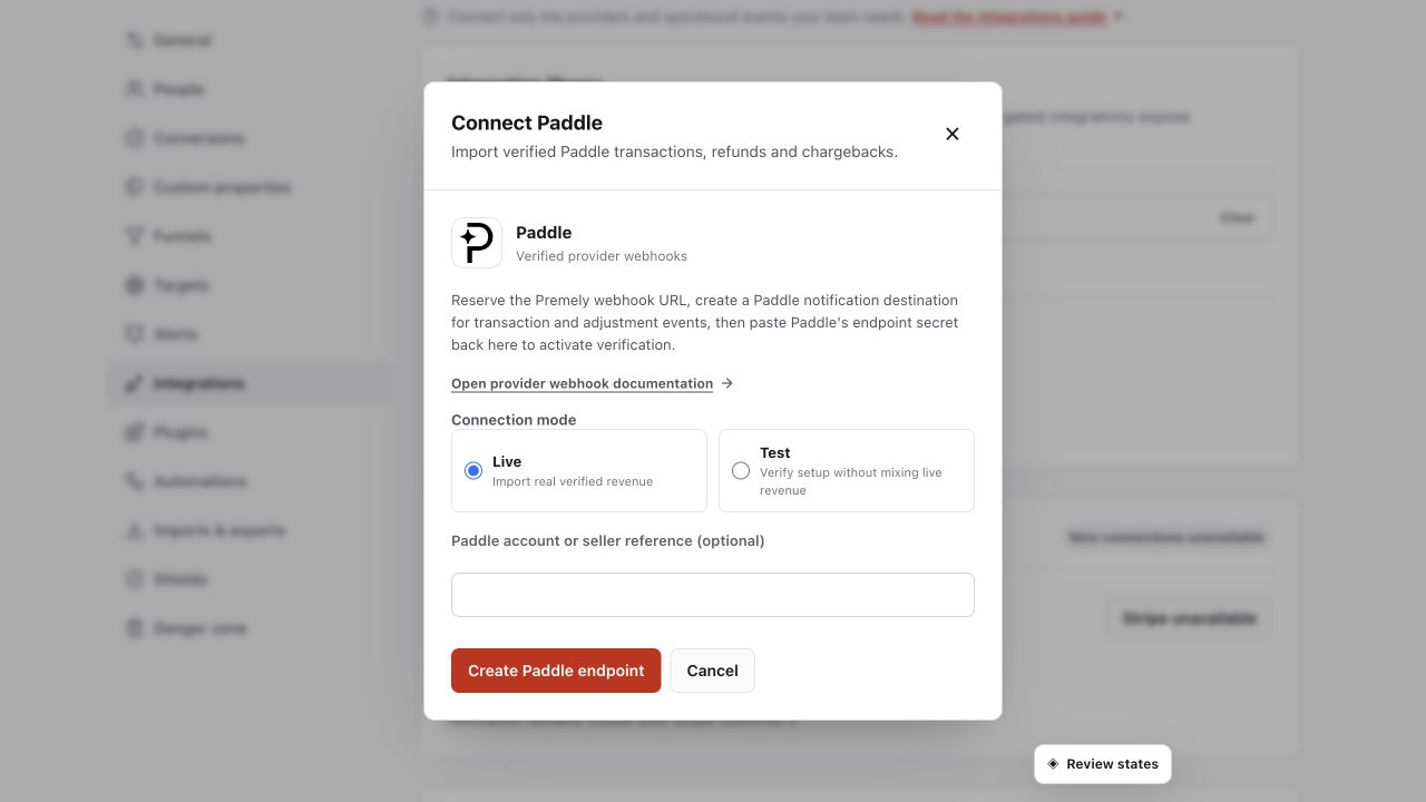 Premely Paddle revenue setup dialog in Light mode with the real Paddle logo and provider-specific connection controls.